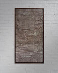 rose gold toned painting concrete, sand, raw pigment textured abstract contemporary painting housed in a walnut wood handcrafted frame. displayed in a modern interior designed home.