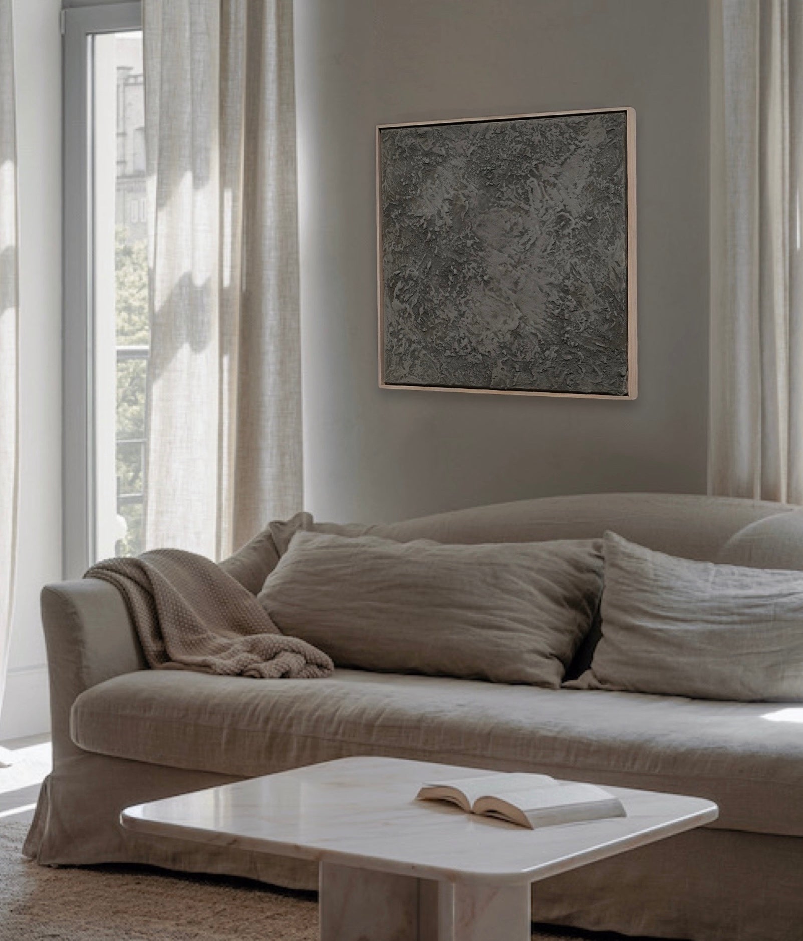 textured painting in a handcrafted poplar wood frame staged in a wabi sabi interior designed room. 