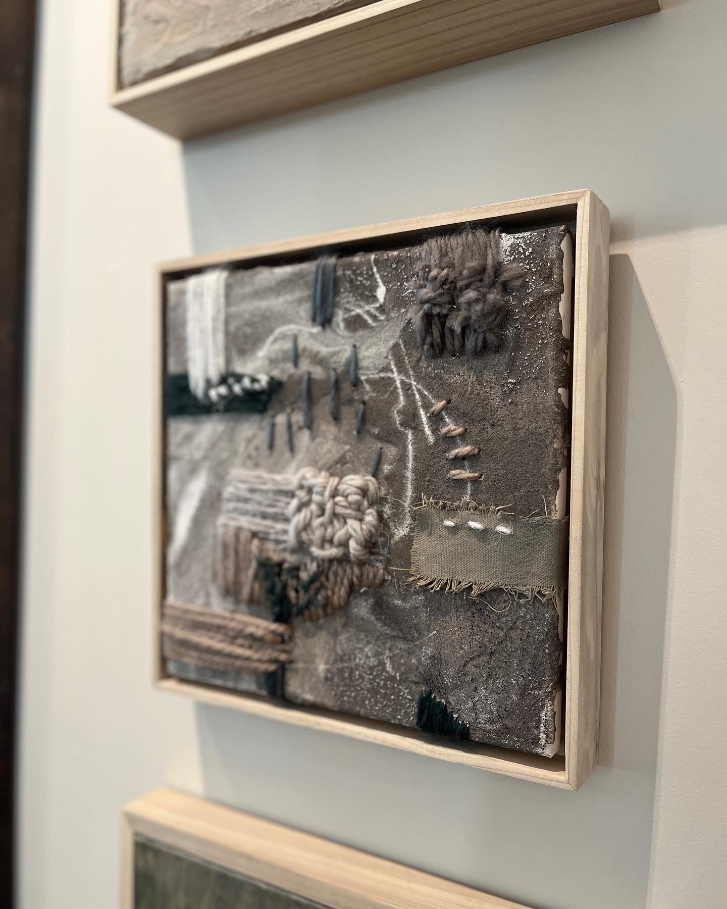 embroidered linen canvas detailed with coffee grounds, coffee, ink, with wool, leather, cotton, ground crystal quartz, in a handcrafted poplar frame. 