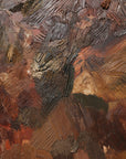 details of a textured sculptural artwork terracotta rust earth toned embroidered with leather 
