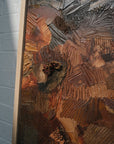 details of a textured sculptural artwork terracotta rust earth toned embroidered with leather 
